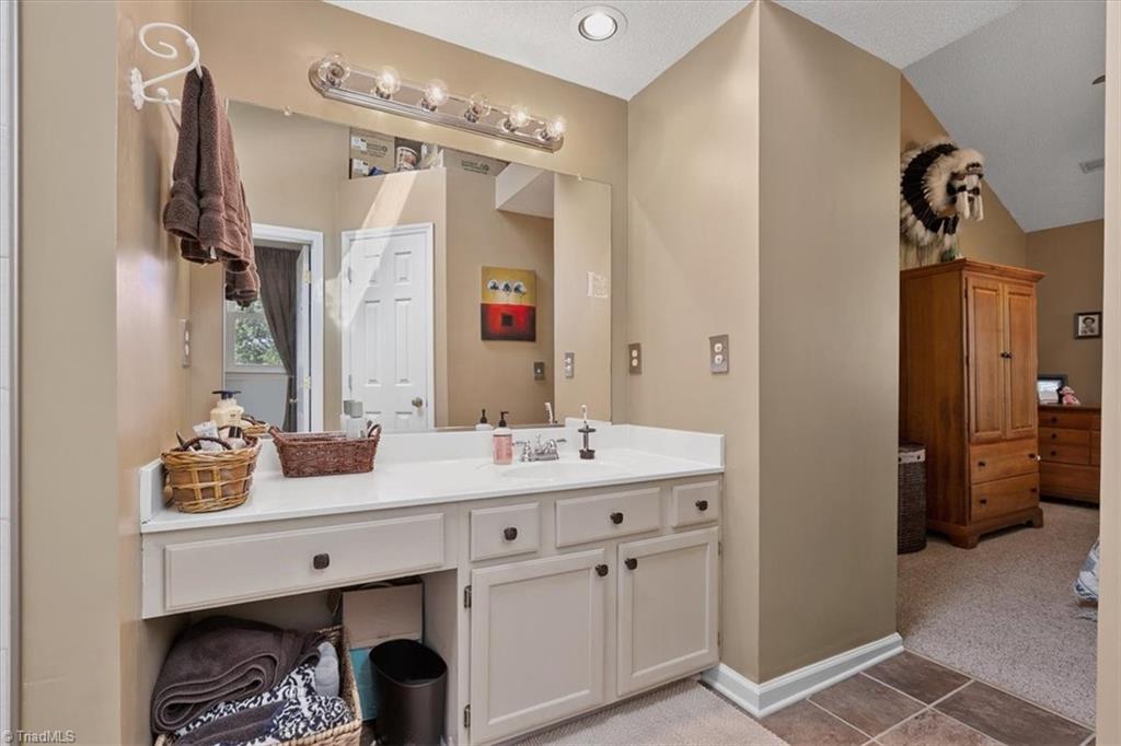 4117 Carroll Ridge Court High Point, NC 27265 - Photo 23 of 35 Primary bathroom with painted vanity.