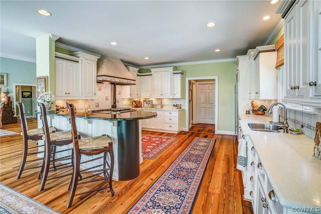 104 Longboat Williamsburg, VA 23188 - Photo 14 of 50 a dining hall with stainless steel appliances granite countertop a table and chairs