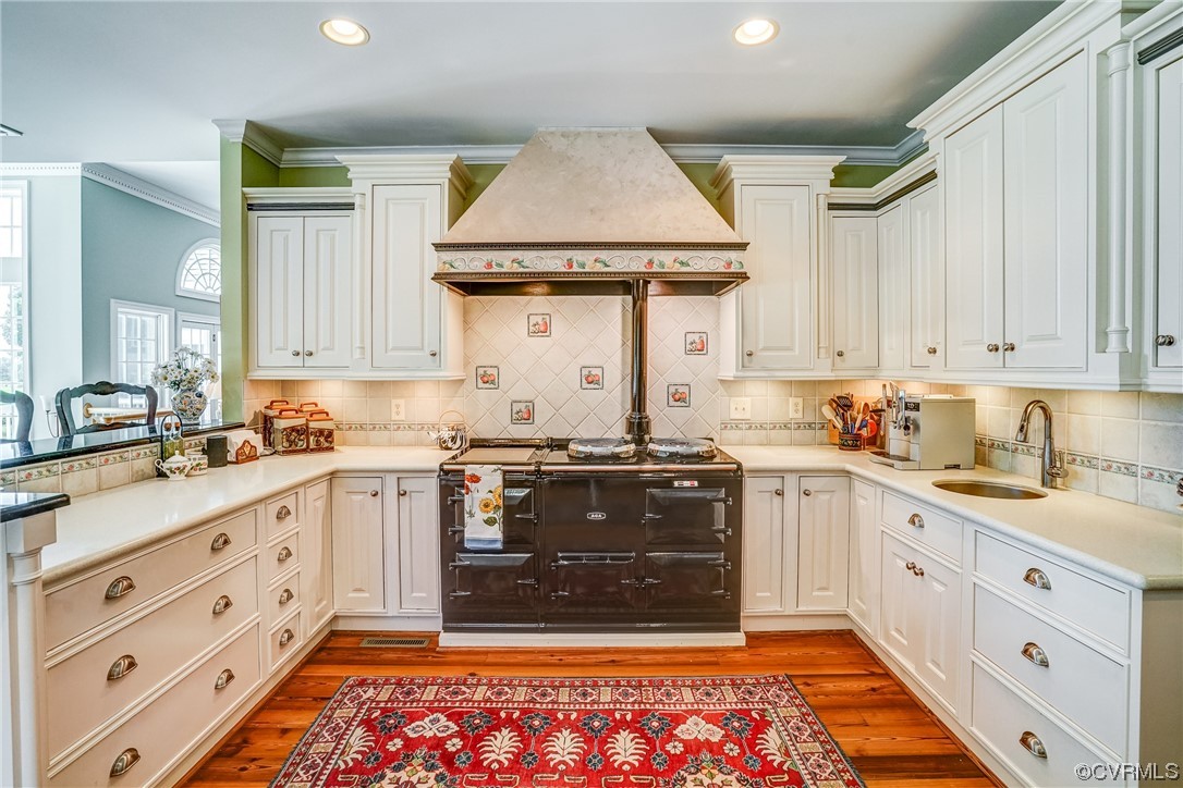 104 Longboat Williamsburg, VA 23188 - Photo 15 of 50 a kitchen with stainless steel appliances granite countertop a sink stove and cabinets