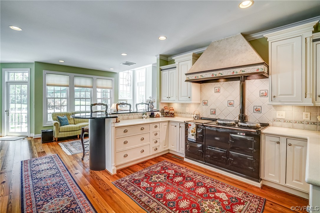 104 Longboat Williamsburg, VA 23188 - Photo 16 of 50 a kitchen with stainless steel appliances granite countertop a stove a sink and a refrigerator