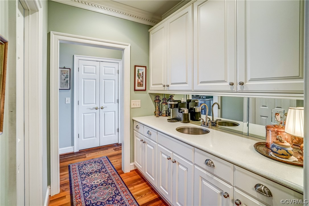 104 Longboat Williamsburg, VA 23188 - Photo 21 of 50 a kitchen with stainless steel appliances granite countertop a sink and dishwasher with white cabinets