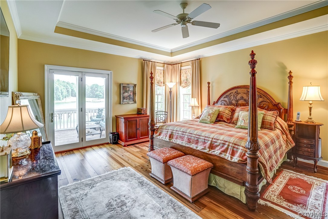 104 Longboat Williamsburg, VA 23188 - Photo 22 of 50 a bedroom with a bed and wooden floor