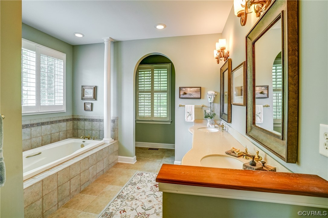 104 Longboat Williamsburg, VA 23188 - Photo 23 of 50 a bathroom with a tub sink and mirror