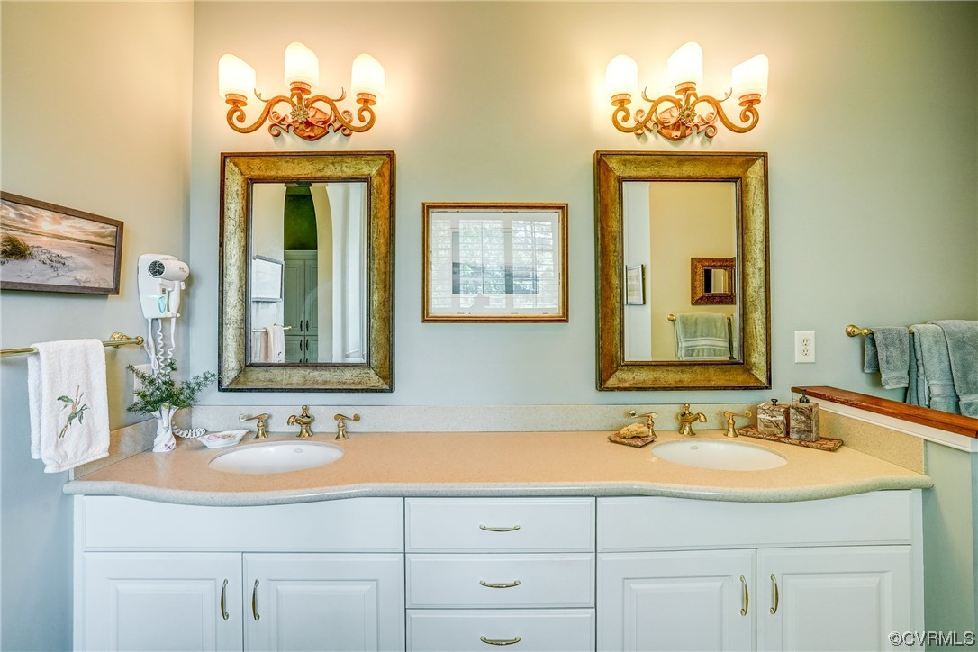 104 Longboat Williamsburg, VA 23188 - Photo 24 of 50 a bathroom with a sink and a mirror