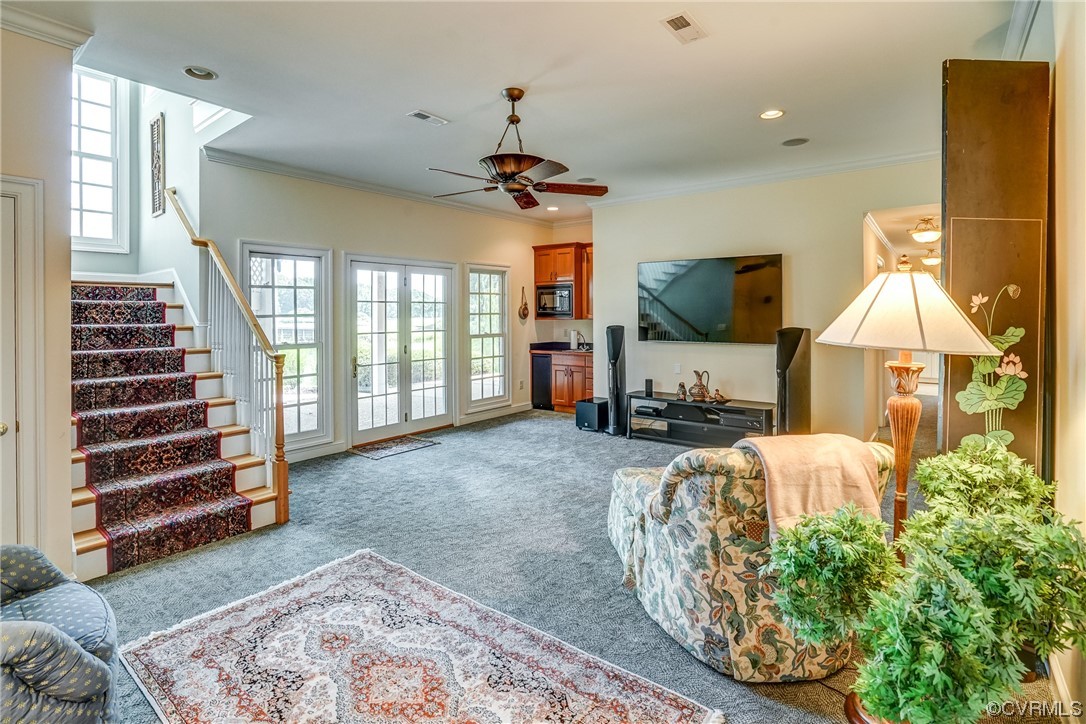 104 Longboat Williamsburg, VA 23188 - Photo 26 of 50 a view of living room kitchen with furniture and flat screen tv