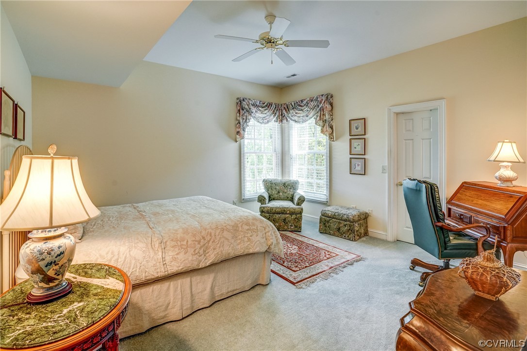 104 Longboat Williamsburg, VA 23188 - Photo 30 of 50 a bedroom with a bed and wooden floor
