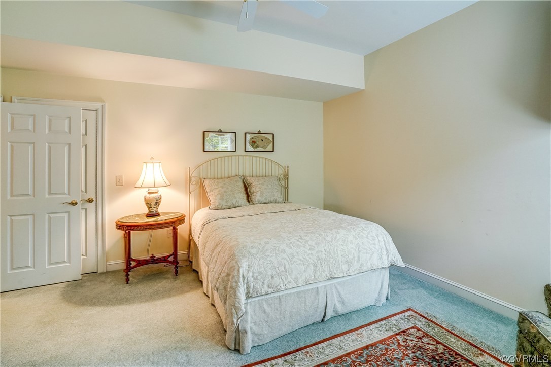 104 Longboat Williamsburg, VA 23188 - Photo 31 of 50 a bedroom with a bed and chair