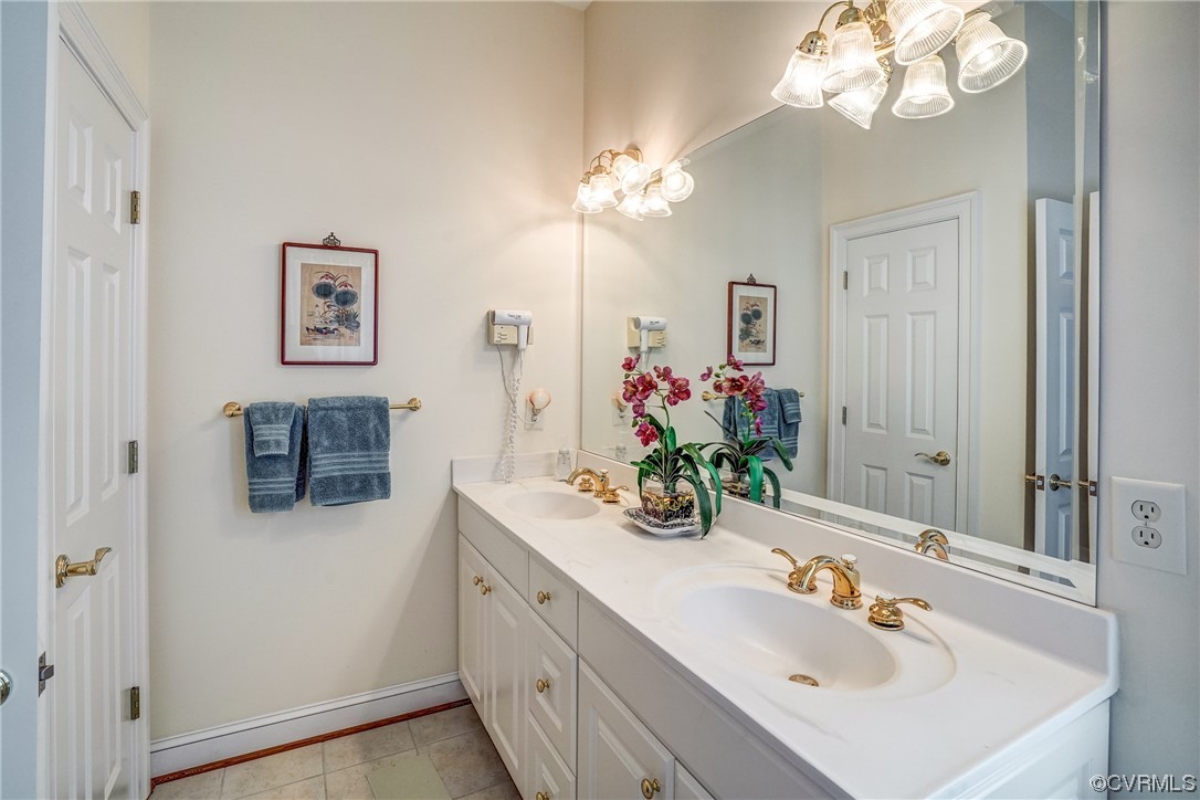 104 Longboat Williamsburg, VA 23188 - Photo 32 of 50 a bathroom with a sink double vanity and a mirror