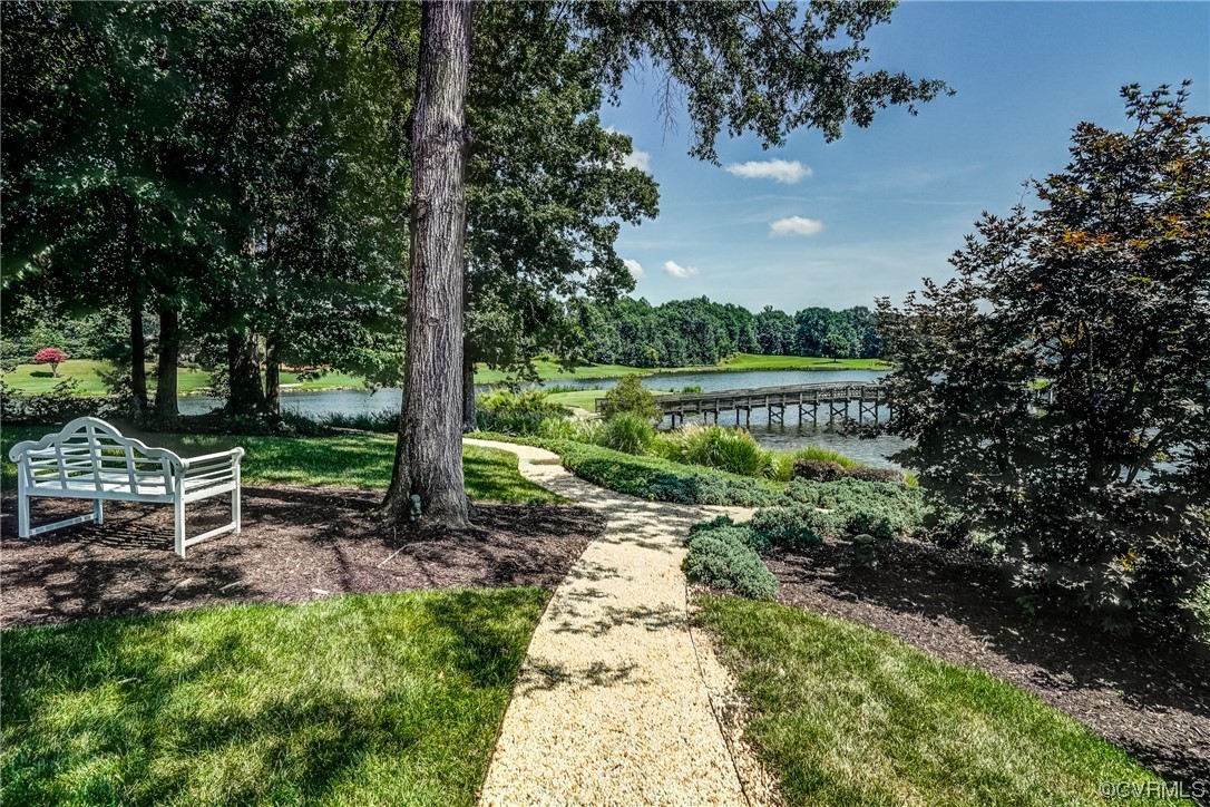 104 Longboat Williamsburg, VA 23188 - Photo 39 of 50 a view of a garden with a bench