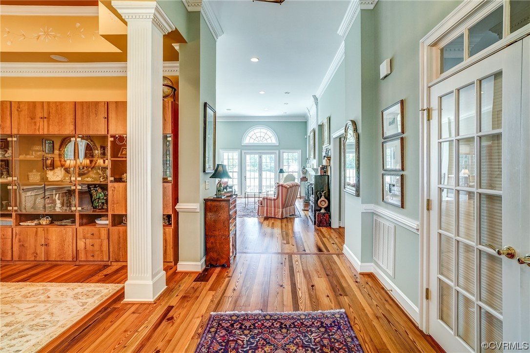 104 Longboat Williamsburg, VA 23188 - Photo 4 of 50 a view of a living room and a dining room with wooden floor