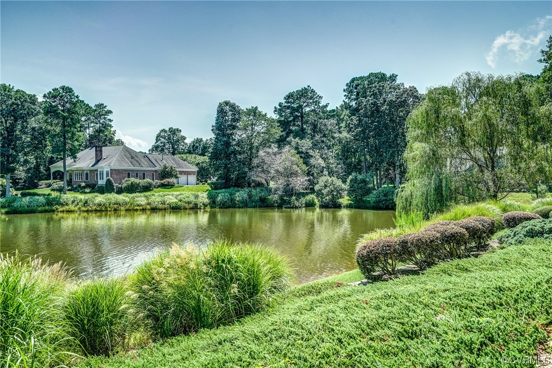 104 Longboat Williamsburg, VA 23188 - Photo 41 of 50 a view of a lake with houses in the back