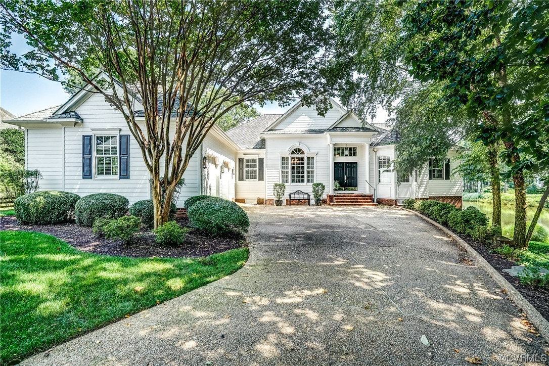 104 Longboat Williamsburg, VA 23188 - Photo 45 of 50 a view of a white house with a big yard and large tree