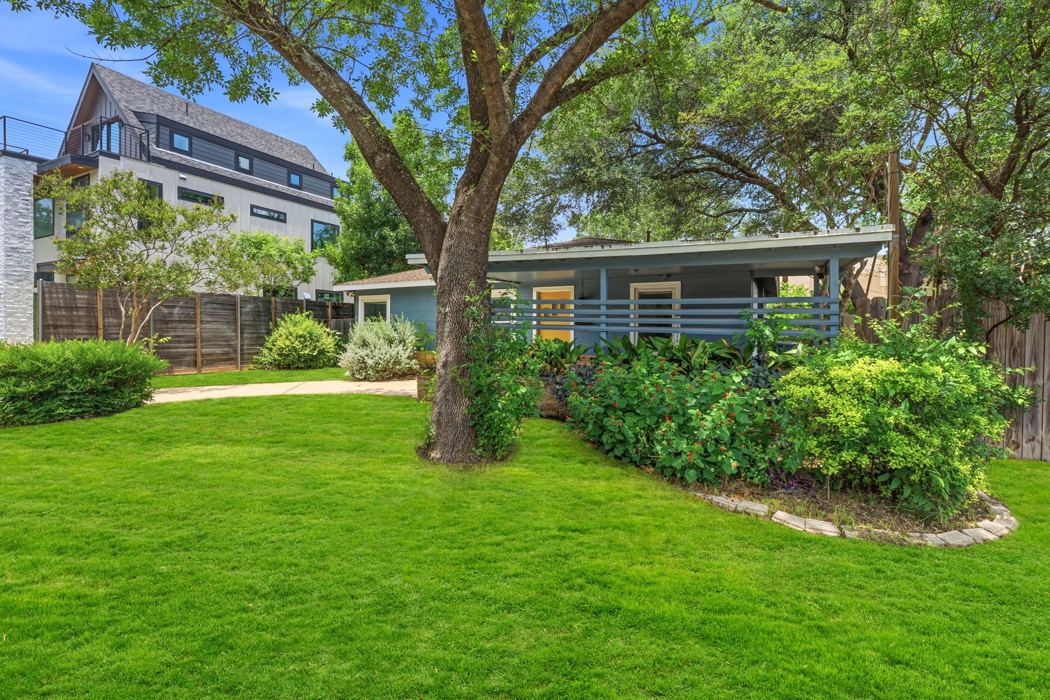 900 Stark Street Austin, TX 78756 - Photo 21 of 25 A well-maintained lawn and mature tree enhance the inviting facade of this delightful residence.