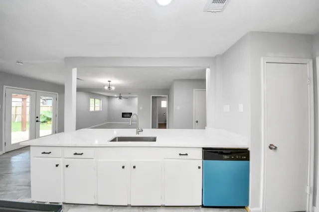 a view of a kitchen counter space and windows