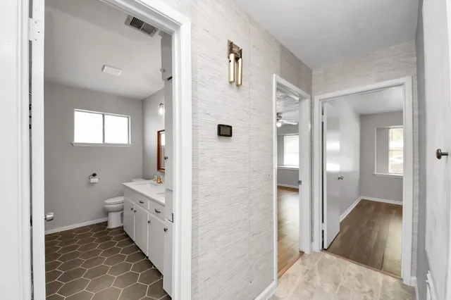 a view of a bathroom with a bathtub and shower