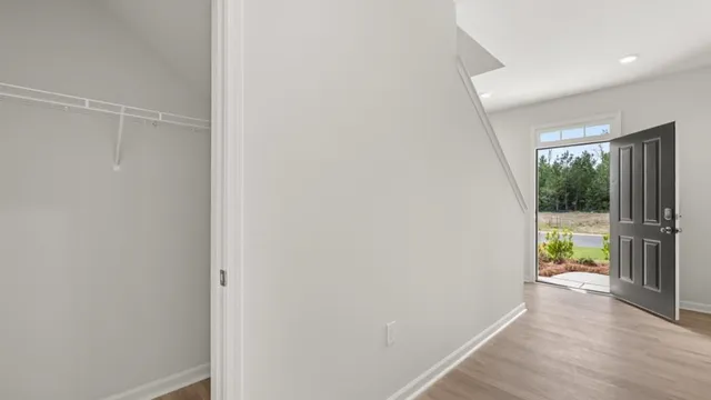 a view of an empty room and a window