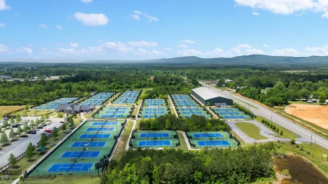 an aerial view of a house with yard
