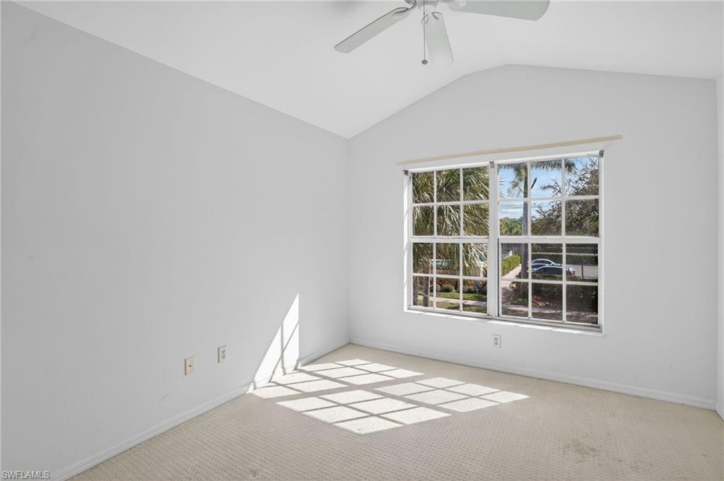 15995 Caldera Lane, Unit 69 Naples, FL 34110 - Photo 15 of 27 Spare room featuring light carpet and ceiling fan