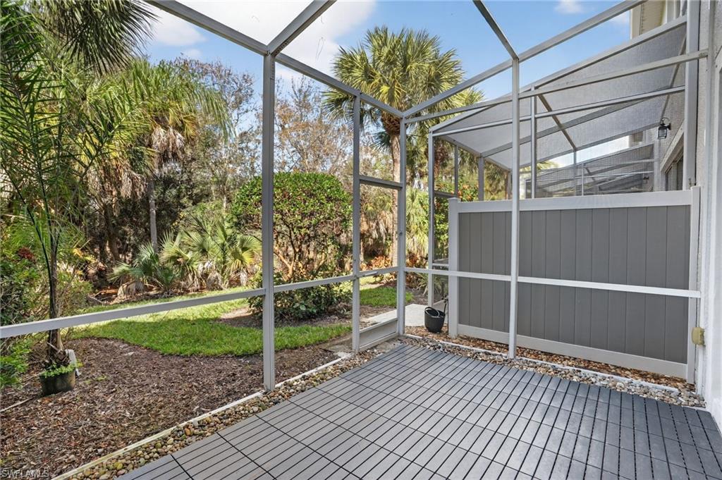 15995 Caldera Lane, Unit 69 Naples, FL 34110 - Photo 22 of 27 View of unfurnished sunroom