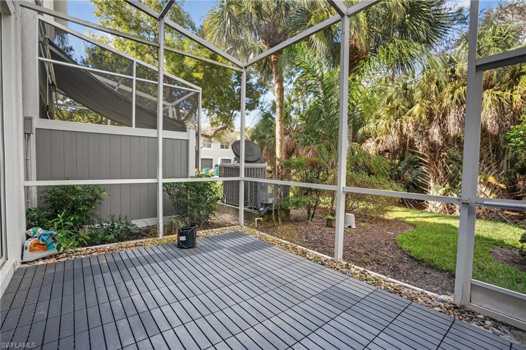 15995 Caldera Lane, Unit 69 Naples, FL 34110 - Photo 23 of 27 View of unfurnished sunroom