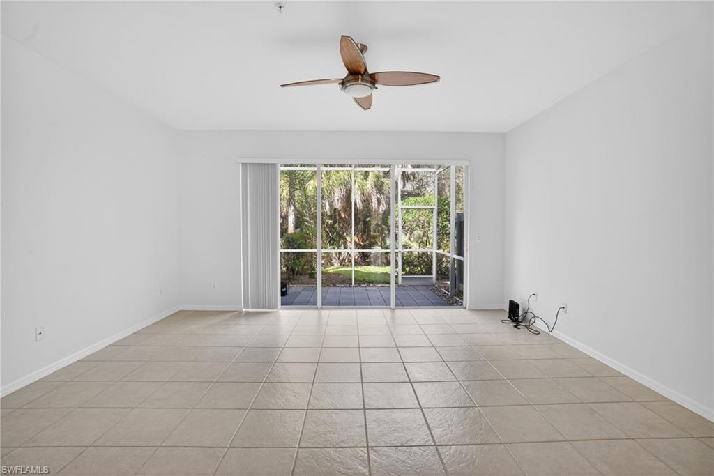 15995 Caldera Lane, Unit 69 Naples, FL 34110 - Photo 6 of 27 Spare room with ceiling fan and light tile patterned floors
