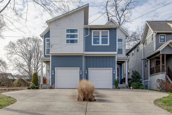 a front view of a house with garage