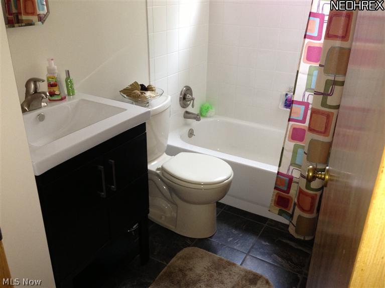 6243 Broadview Road Cleveland, OH 44134 - Photo 16 of 25 Updated bathroom with ceramic floor and tub surround. Newer fixtures.