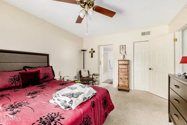 a bedroom with a bed and a walk in closet