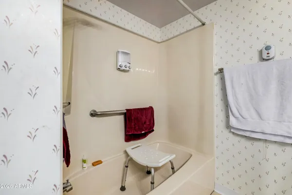a view of storage and utility room with washer and dryer