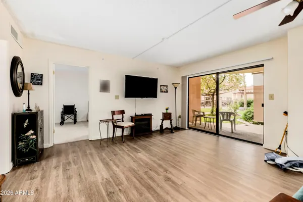 a view of a livingroom with furniture and a flat screen tv