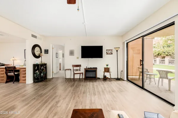 a living room with furniture and a flat screen tv