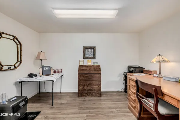 a view of a workspace with furniture