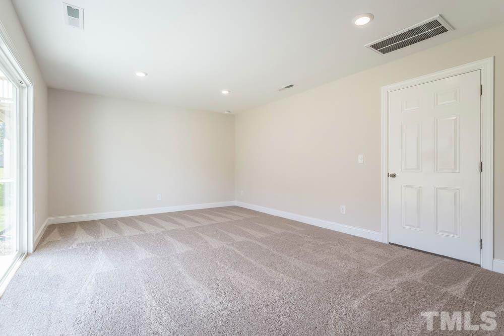 6913 Point Bar Place Raleigh, NC 27616 - Photo 12 of 23 an empty room with a empty space and a window