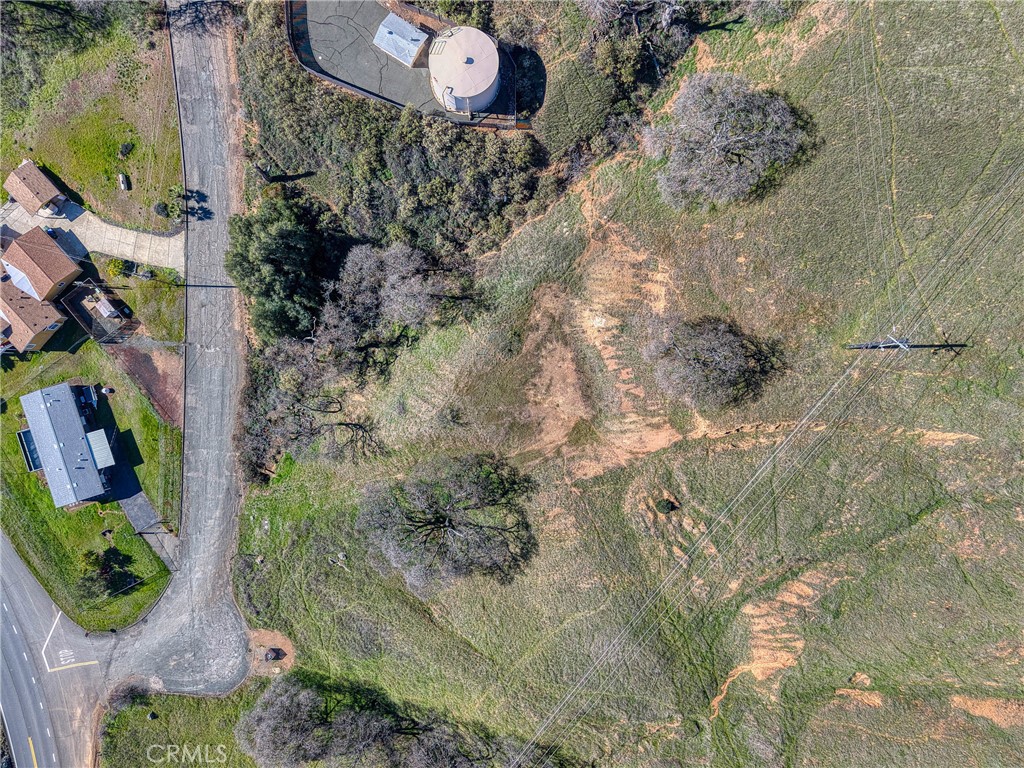 7780 Verna Way Lucerne, CA 95458 - Photo 23 of 28 a aerial view of a house with a yard and large trees