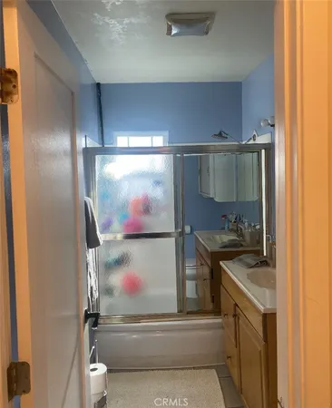 a kitchen with a stove and a refrigerator