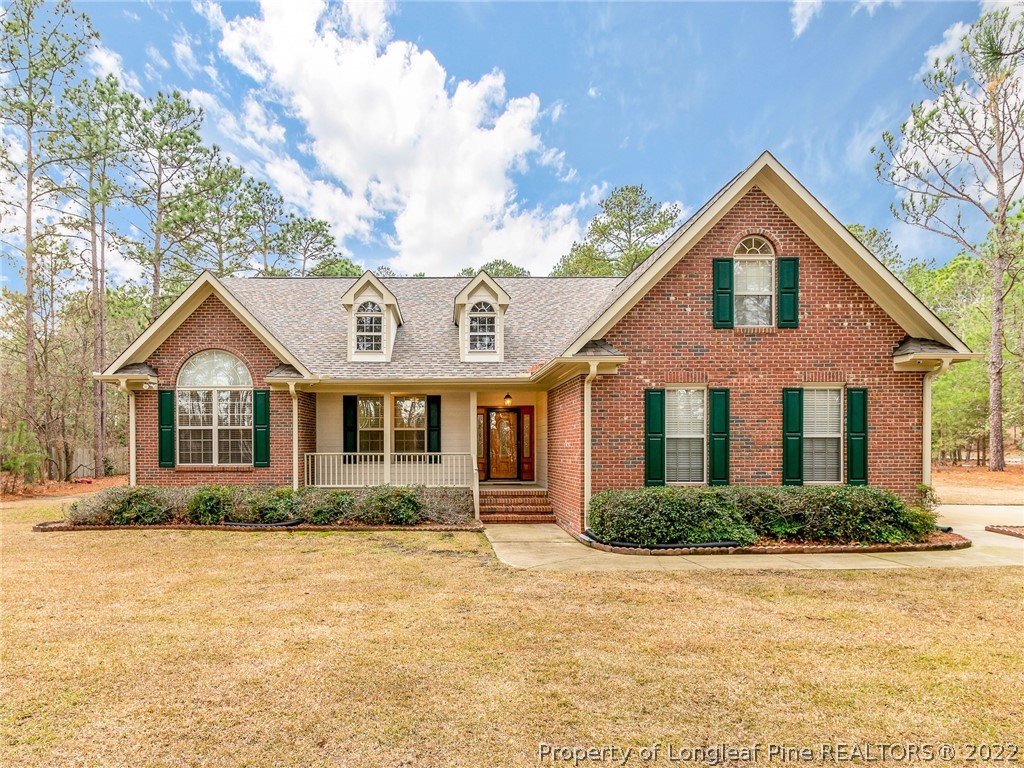 119 Myra Road Raeford, NC 28376 - Photo 1 of 43 a front view of a house with garden