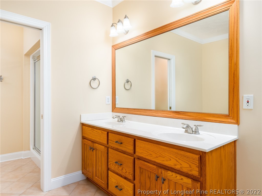 119 Myra Road Raeford, NC 28376 - Photo 27 of 43 a bathroom with a sink and a mirror