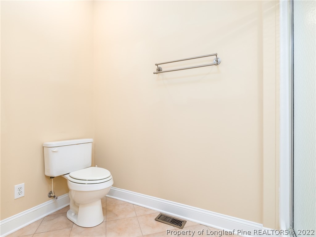 119 Myra Road Raeford, NC 28376 - Photo 29 of 43 a bathroom with a toilet and a picture