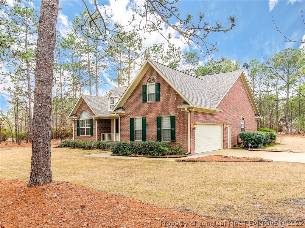 119 Myra Road Raeford, NC 28376 - Photo 3 of 43 a front view of house with yard and trees around