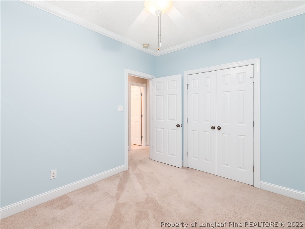 119 Myra Road Raeford, NC 28376 - Photo 34 of 43 a view of an empty room and a chandelier fan