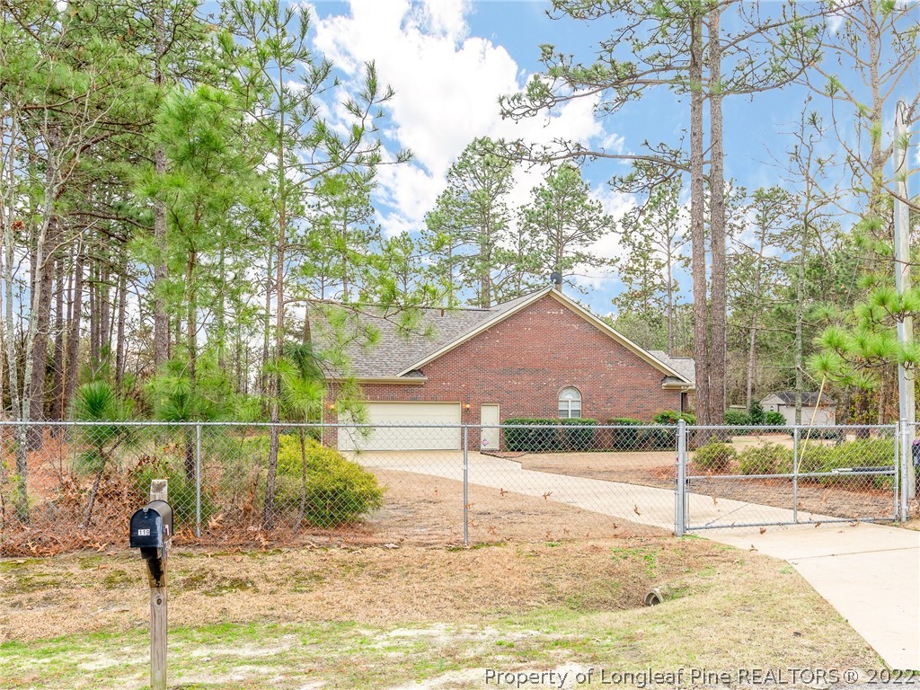 119 Myra Road Raeford, NC 28376 - Photo 5 of 43 a house view with a garden space