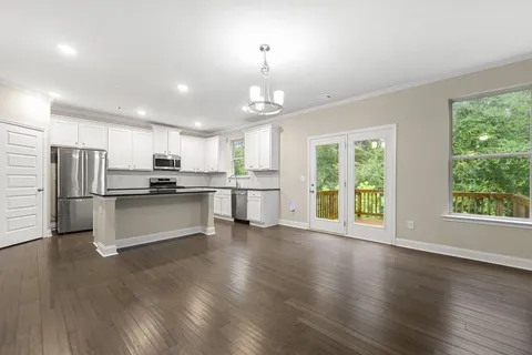 a kitchen with stainless steel appliances refrigerator oven microwave and stove