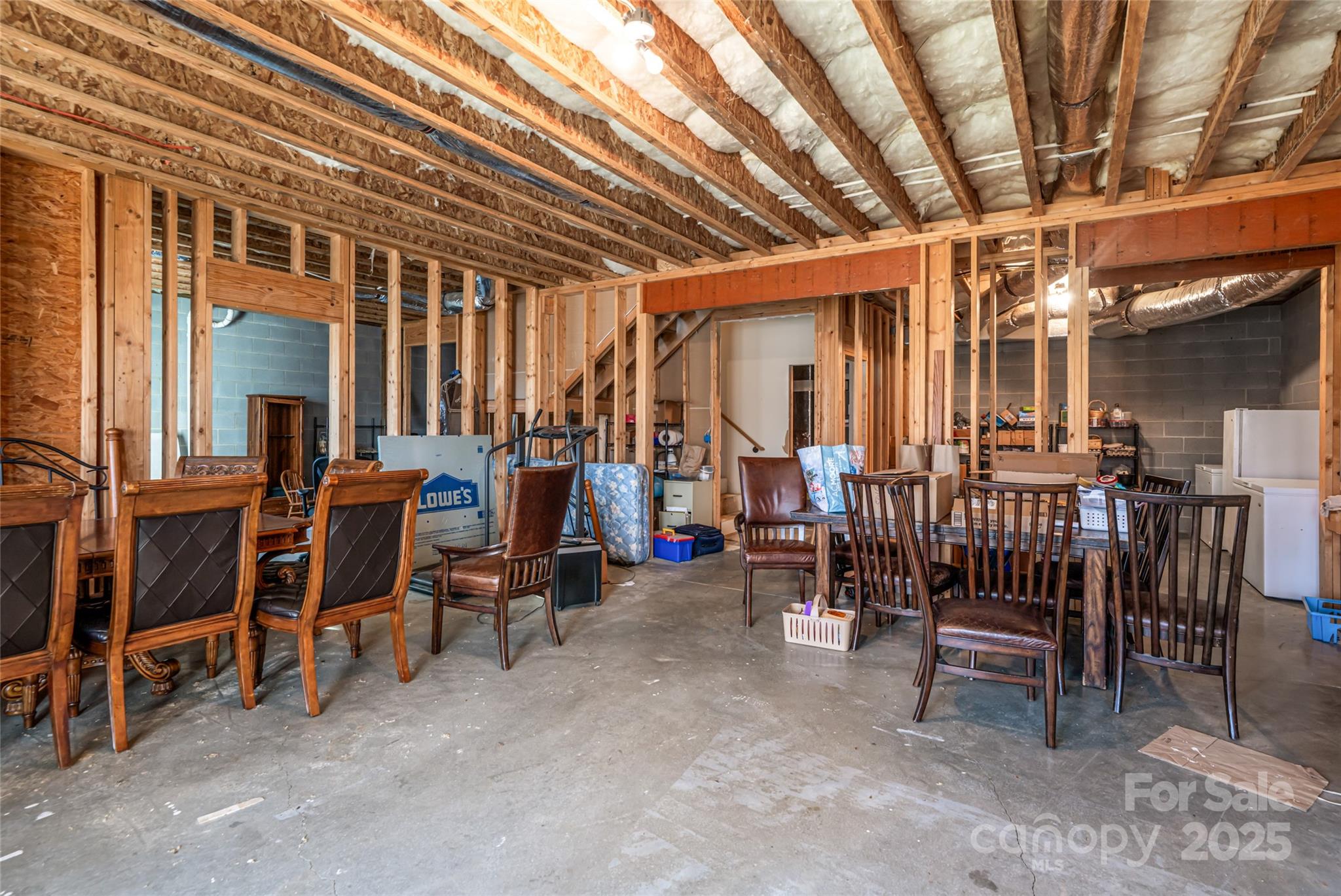 98 Sovereign Lane Fairview, NC 28730 - Photo 30 of 42 a view of a chairs and tables in the back yard of the house