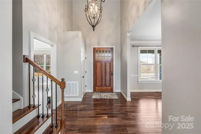 a view of an entryway with wooden floor
