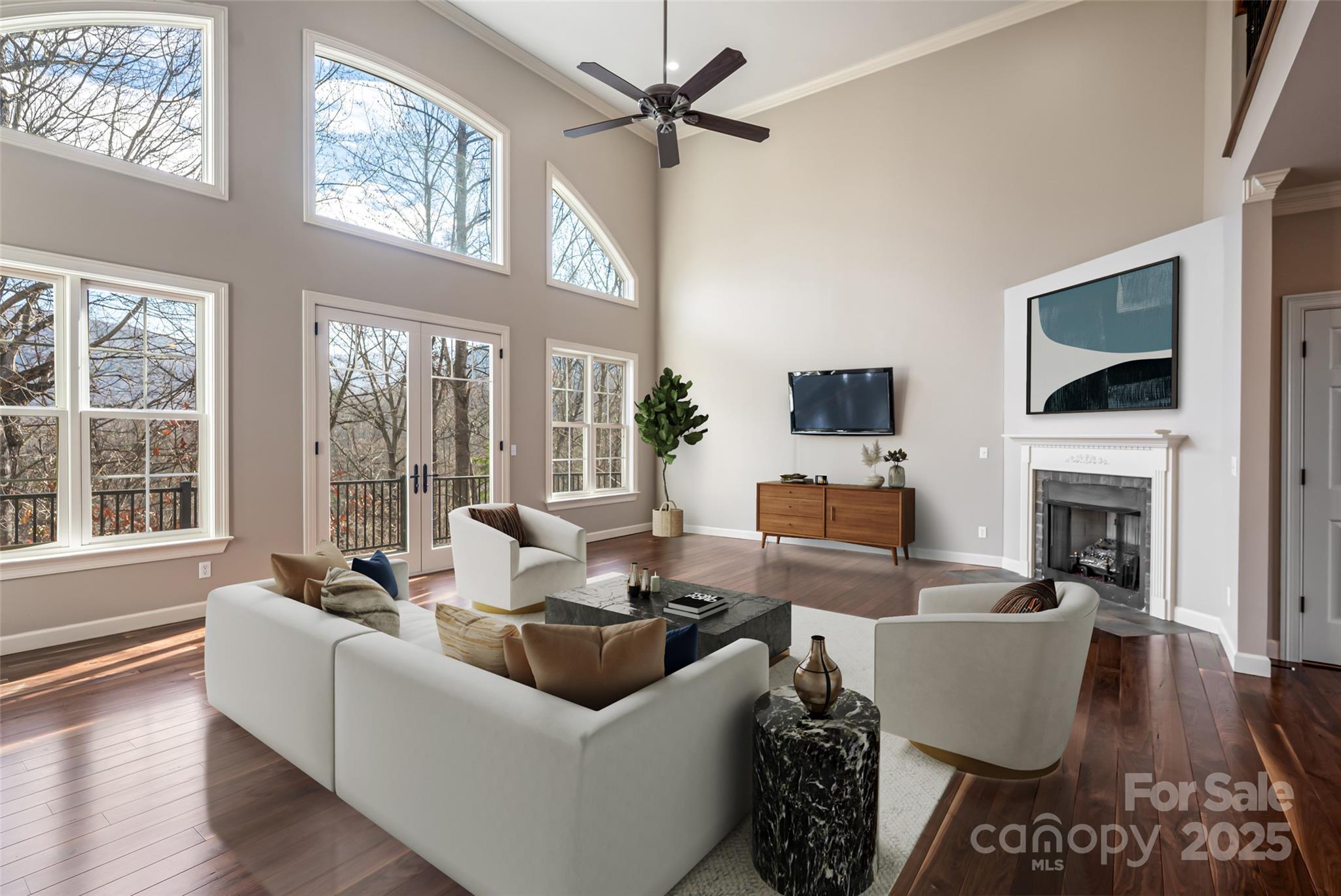 98 Sovereign Lane Fairview, NC 28730 - Photo 5 of 42 a living room with furniture fireplace and flat screen tv