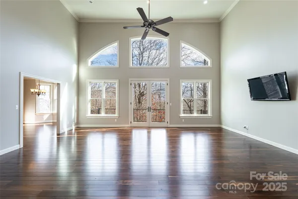 a view of an entryway with wooden floor