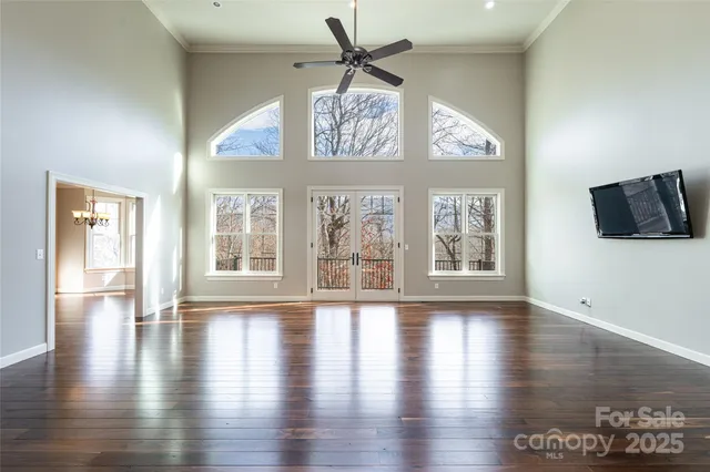 a view of an entryway with wooden floor