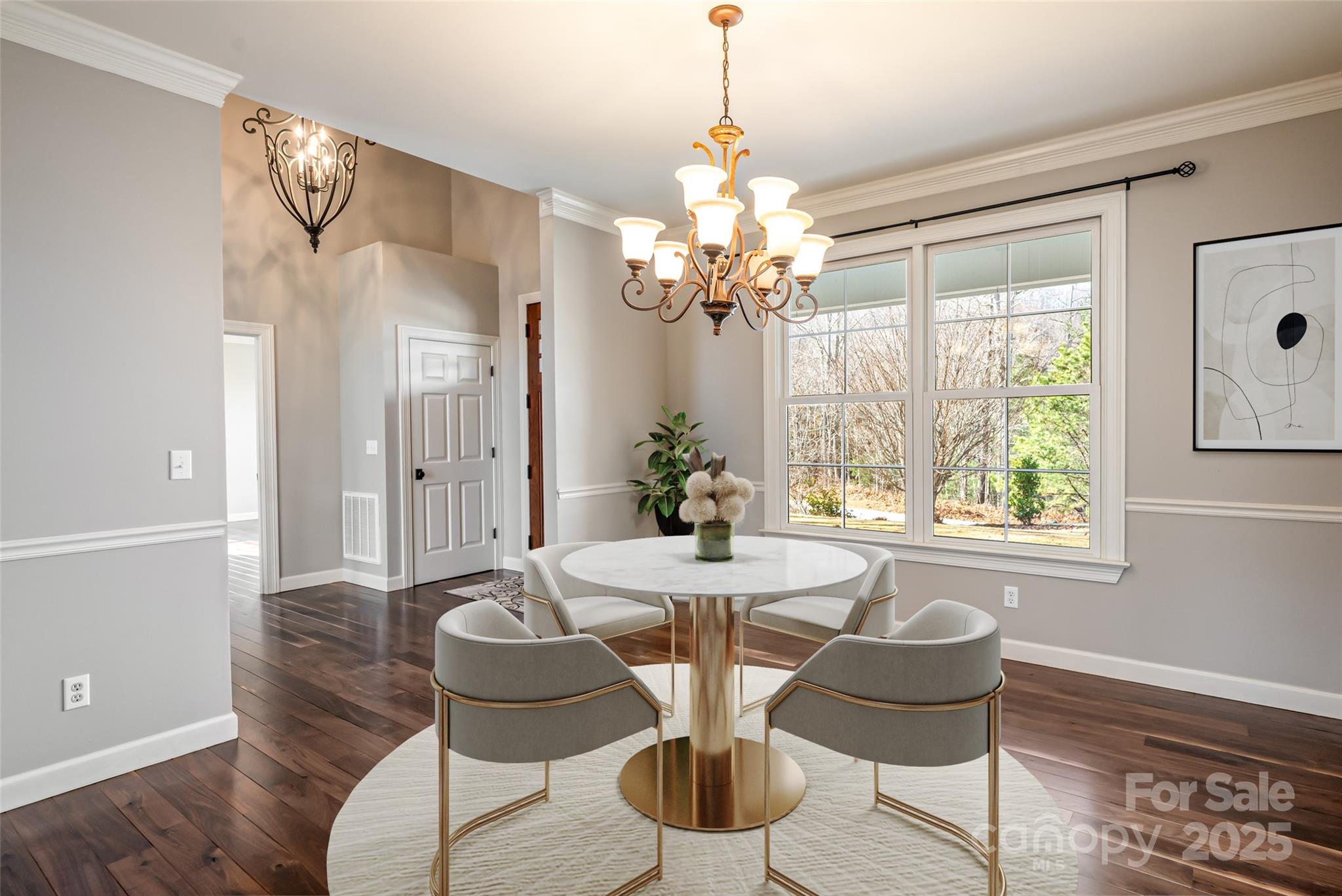 98 Sovereign Lane Fairview, NC 28730 - Photo 9 of 42 a dining room with furniture a chandelier and wooden floor