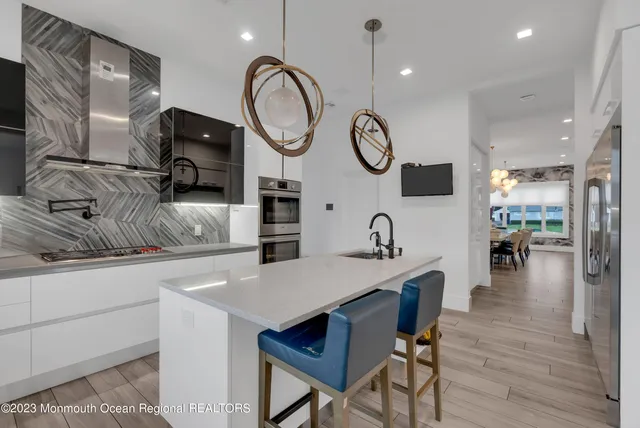 a kitchen with a table and chairs in it