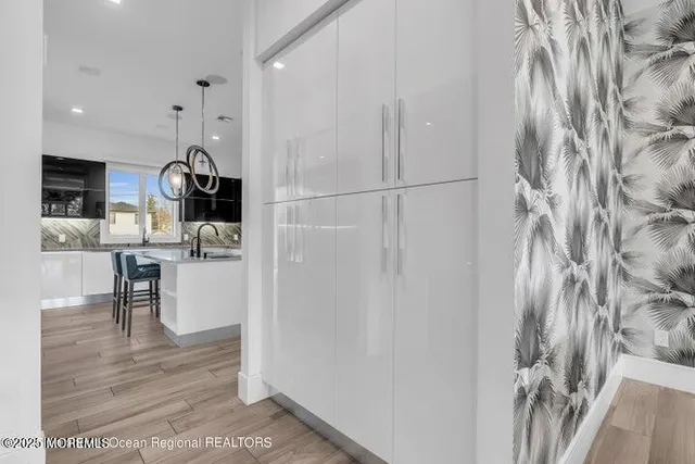 a view of kitchen with furniture and wooden floor